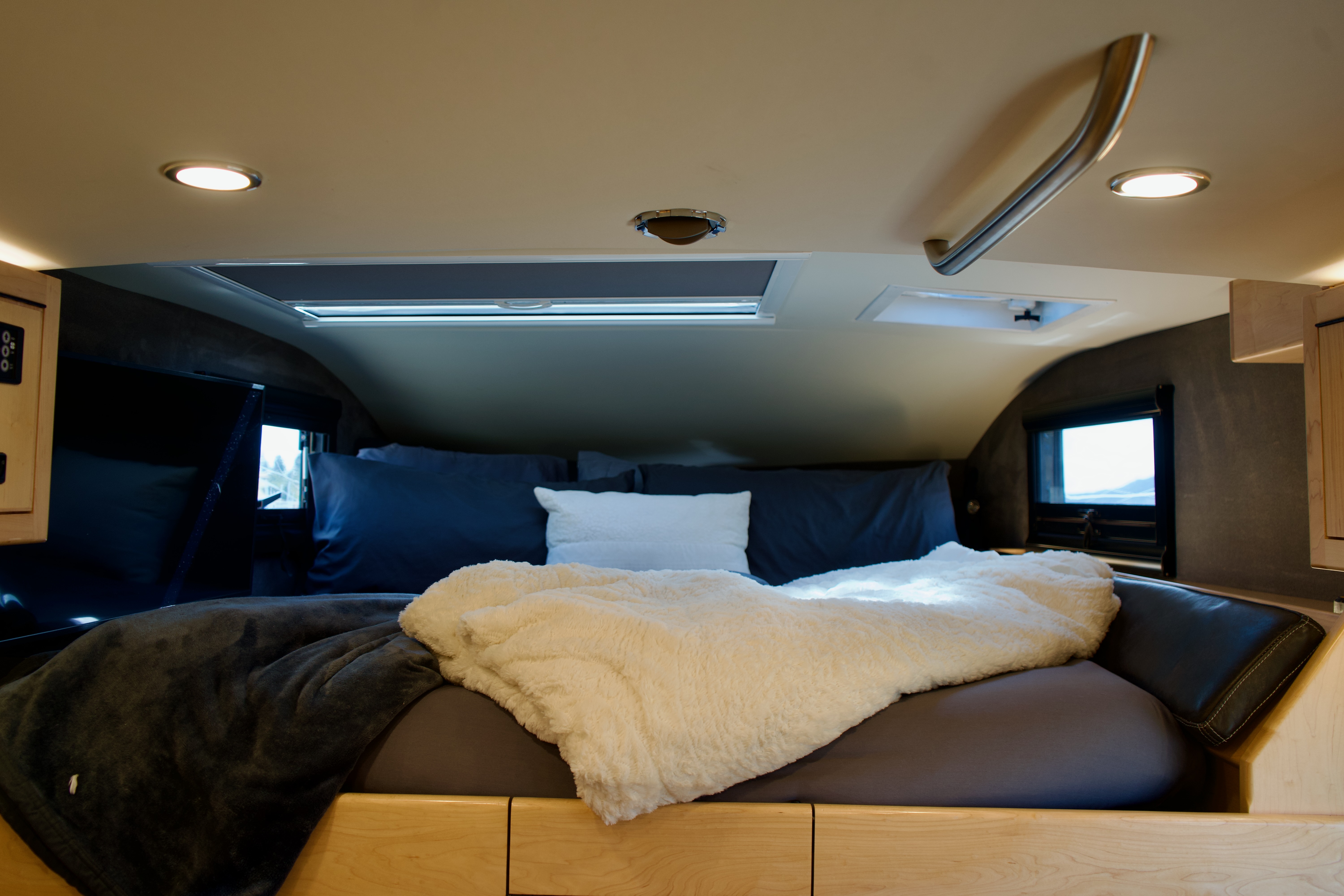 Cabover queen bed with bedding